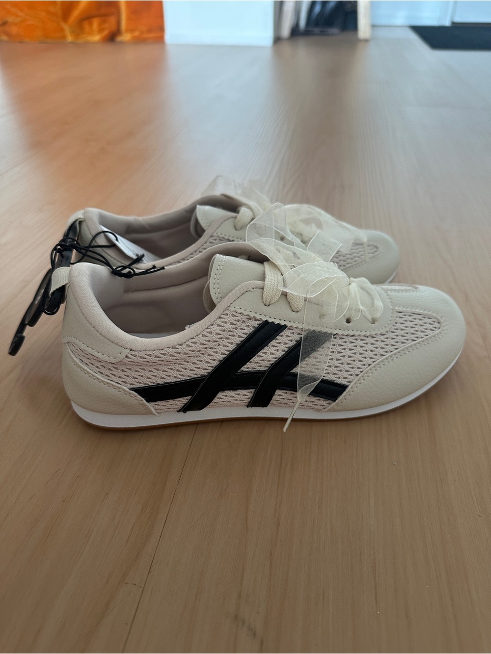 Cream Sneakers with Black Stripes